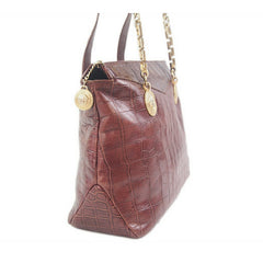 Vintage Gianni Versace brown croc-embossed leather shoulder tote bag with golden hardware and medusa charms.