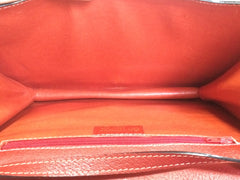 Vintage Valentino Garavani red pigskin shoulder clutch bag with unique logo stitch mark.