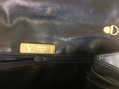 Vintage Valentino Garavani, Black nappa leather clutch purse, shoulder bag with tied bow, ribbon and V logo motif at front. 060616r4