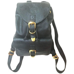Vintage Gianni Versace black leather backpack with a big embossed medusa with gold tone hardware. Unisex bag for daily use.