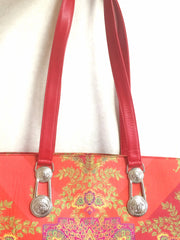 Vintage Gianni Versace gorgeous red orange and multi color ethnic and flower design shoulder, tote bag with silver medusa motifs. Lady Gaga