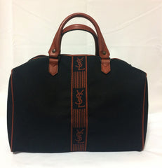 Vintage Yves Saint Laurent black canvas duffle handbag, mini travel bag with brown trimmings and YSL logo. Unisex purse for daily use.