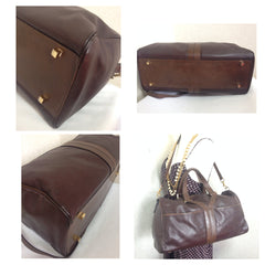 70's, 80's vintage Yves Saint Laurent genuine dark brown leather travel and daily use duffle bag. Classic unisex style YSL purse