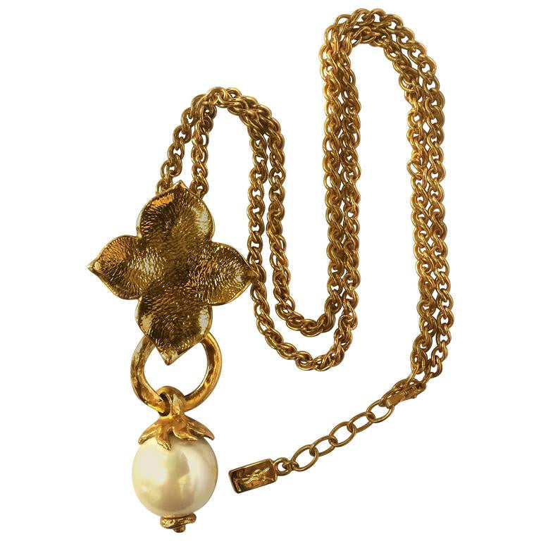 MINT. Vintage Yves Saint Laurent golden chain long statement necklace with extra large faux pearl and flower petal pendant top. Opal shine