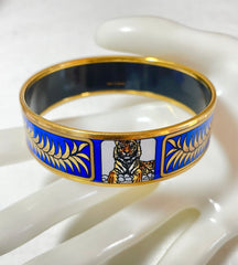 Vintage Hermes blue cloisonne enamel golden thick bangle, bracelet with tiger and leaves design in blue and gold. 070114ac3