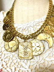 Vintage Yves Saint Laurent statement necklace with motif charms. Heart, moon, star, clover, bird, butterfly, and YSL logo. 060903ac2