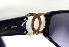 Vintage CHANEL black frame sunglasses with large CC motifs at sides. Mod and chic eyewear you must get. 060828ac1