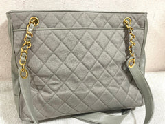 Vintage CHANEL taupe grey canvas and lambskin shoulder tote bag with gold tone chain straps and a CC ball charm. 070125ap1