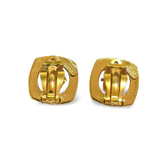 Vintage Gianni Versace clear and gold tone medusa face motif earrings. Classic jewelry. 060305m