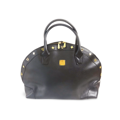 Vintage MCM black grained leather bolide type handbag with golden logo studs. Designed by Michael Cromer. Nature collection. 060620re4