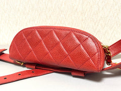 Vintage CHANEL red caviar leather waist bag, fanny pack purse with a matching leather belt and logo charm pull. 26” thru 28”. 070819ac2