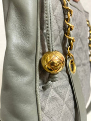 Vintage CHANEL taupe grey canvas and lambskin shoulder tote bag with gold tone chain straps and a CC ball charm. 070125ap1