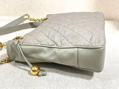 Vintage CHANEL taupe grey canvas and lambskin shoulder tote bag with gold tone chain straps and a CC ball charm. 070125ap1