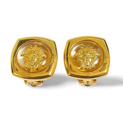 Vintage Gianni Versace clear and gold tone medusa face motif earrings. Classic jewelry. 060305m