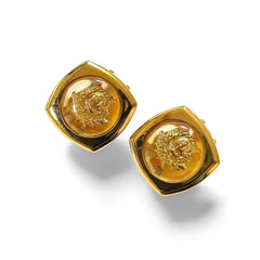 Vintage Gianni Versace clear and gold tone medusa face motif earrings. Classic jewelry. 060305m