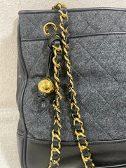 Vintage CHANEL taupe grey canvas and lambskin shoulder tote bag with gold tone chain straps and a CC ball charm. 070125ap2