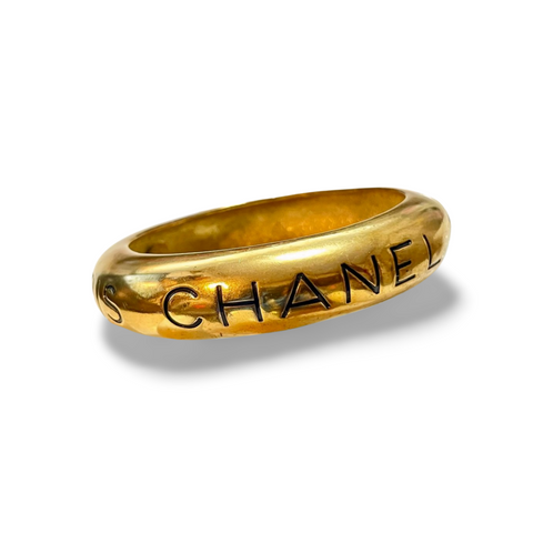 Vintage Chanel golden bangle with embossed black logo.  Must have gorgeous jewelry. 060810r1