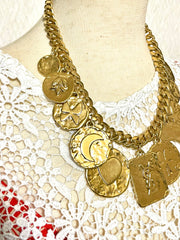 Vintage Yves Saint Laurent statement necklace with motif charms. Heart, moon, star, clover, bird, butterfly, and YSL logo. 060903ac2