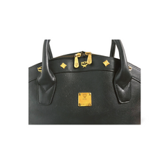 Vintage MCM black grained leather bolide type handbag with golden logo studs. Designed by Michael Cromer. Nature collection. 060620re4