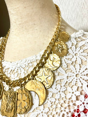 Vintage Yves Saint Laurent statement necklace with motif charms. Heart, moon, star, clover, bird, butterfly, and YSL logo. 060903ac2