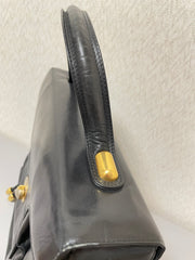 Vintage Bally black leather retro pop design bag, business purse with gold tone drawstrings and unique flap cut design.  Unisex use. 160315