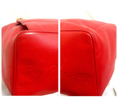 Vintage Paloma Picasso red leather backpack with golden logo motifs. Classic bag for unisex use. 060616r