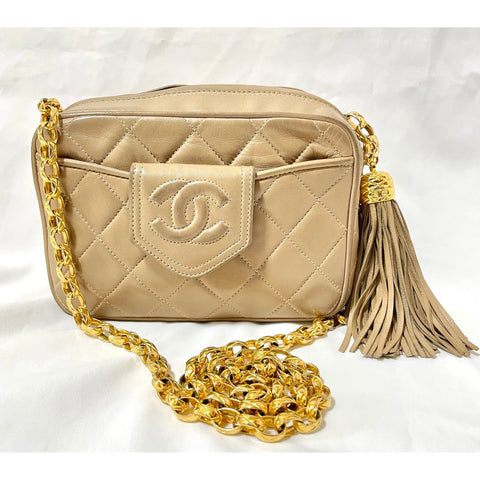 Vintage Chanel tanned beige lambskin camera bag style chain shoulder bag with fringe and CC stitch mark on pentagon flap. 051205ac3