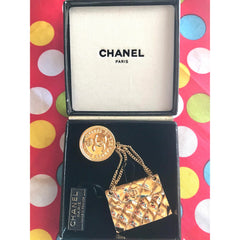 MINT. Vintage CHANEL Gold tone brooch with 2.55 classic purse and CC charms. Chic dangling brooch. Gorgeous masterpiece jewelry. 050406r4
