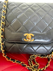 Vintage Chanel black lambskin chain 2.55 shoulder bag with gold chain. Unique hexagon shaped flap. 0407012