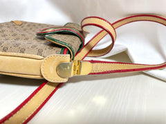 Vintage Gucci GG monogram shoulder bag with red and green webbing color convo shoulder bag. Golden and silver GG motif on the flap. 0411273