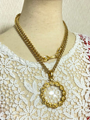 Vintage CHANEL long chain necklace with round glass loupe pendant top and CC motifs. Can be worn in double. Gorgeous masterpiece.0411111