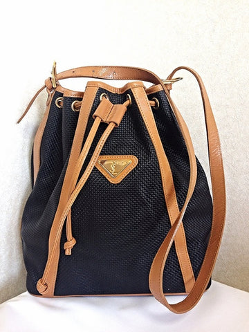 Vintage Yves Saint Laurent  black hobo bucket shoulder bag with brown leather trimmings and golden logo plate. YSL classic unisex purse.