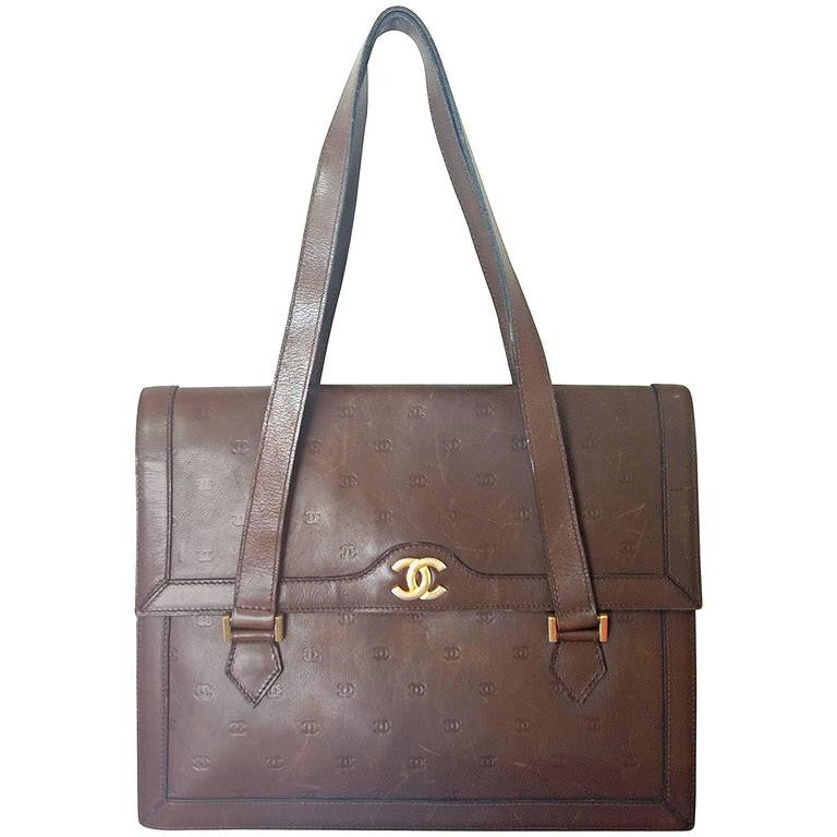 70s, 80s vintage CHANEL cocoa brown calfskin handbag with gold tone CC motif and mini CC motifs allover. Rare masterpiece  back in the era.