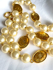Vintage CHANEL classic faux pearl necklace with oval CC coin charms. 041205bs7