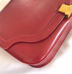 Vintage Lanvin wine leather shoulder bag with golden logo motif closure. Classic must have purse.
