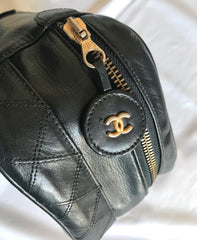 Vintage CHANEL calfskin classic cosmetic and toiletry black pouch, vanity bag with CC charm. Classic make up case.