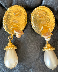 Vintage CHANEL oval shape and teardrop pearl dangle earrings with golden frames. Classic jewelry. 050113an2