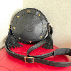 Vintage MCM black suzy wong, grained leather round shoulder bag with golden logo studs and fringes. Designed by Michael Cromer.0407051