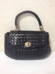 Vintage rare Bottega Veneta intreciato woven leather purse in black with unique opening closure motif. One of a kind.
