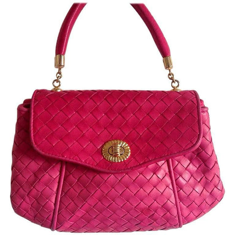 Vintage Bottega Veneta intrecciato woven leather purse in hot pink with unique opening closure motif. One of a kind