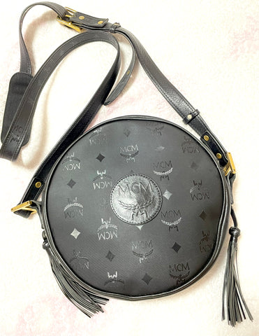 Vintage MCM black monogram rare round shape shoulder bag with black leather trimmings and fringes. unisex use. Suzy Wong. 0408161