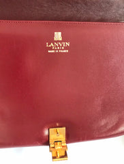 Vintage Lanvin wine leather shoulder bag with golden logo motif closure. Classic must have purse.