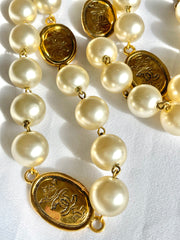 Vintage CHANEL classic faux pearl necklace with oval CC coin charms. 041205bs7