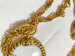 Vintage CHANEL long chain necklace with round loupe glass pendant top and CC motif. Gorgeous masterpiece. 0408246