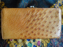 Vintage GUCCI tanned brown genuine ostrich leather wallet with gold tone GG logo motif. Masterpiece and rare vintage for unisex use