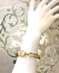 Vintage Roberta di Camerino chain bracelet with white logo charms. Beautiful jewelry.
