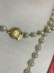 Vintage CHANEL faux pearl necklace, extra long necklace with golden round logo motif. Must have classic jewelry piece. 0408152