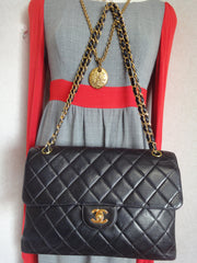 Vintage CHANEL black lambskin 2.55 classic jumbo, large shoulder bag with double side flap and golden CC closure