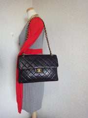 Vintage CHANEL black lambskin 2.55 classic jumbo, large shoulder bag with double side flap and golden CC closure