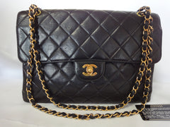 Vintage CHANEL black lambskin 2.55 classic jumbo, large shoulder bag with double side flap and golden CC closure